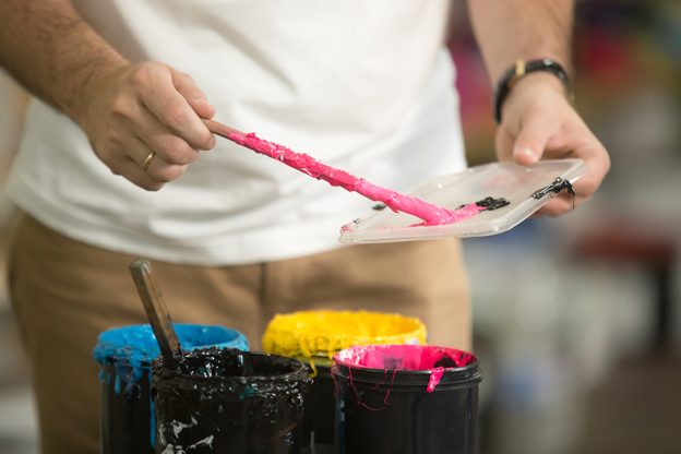 close-up-male-hands-combining-cmyk